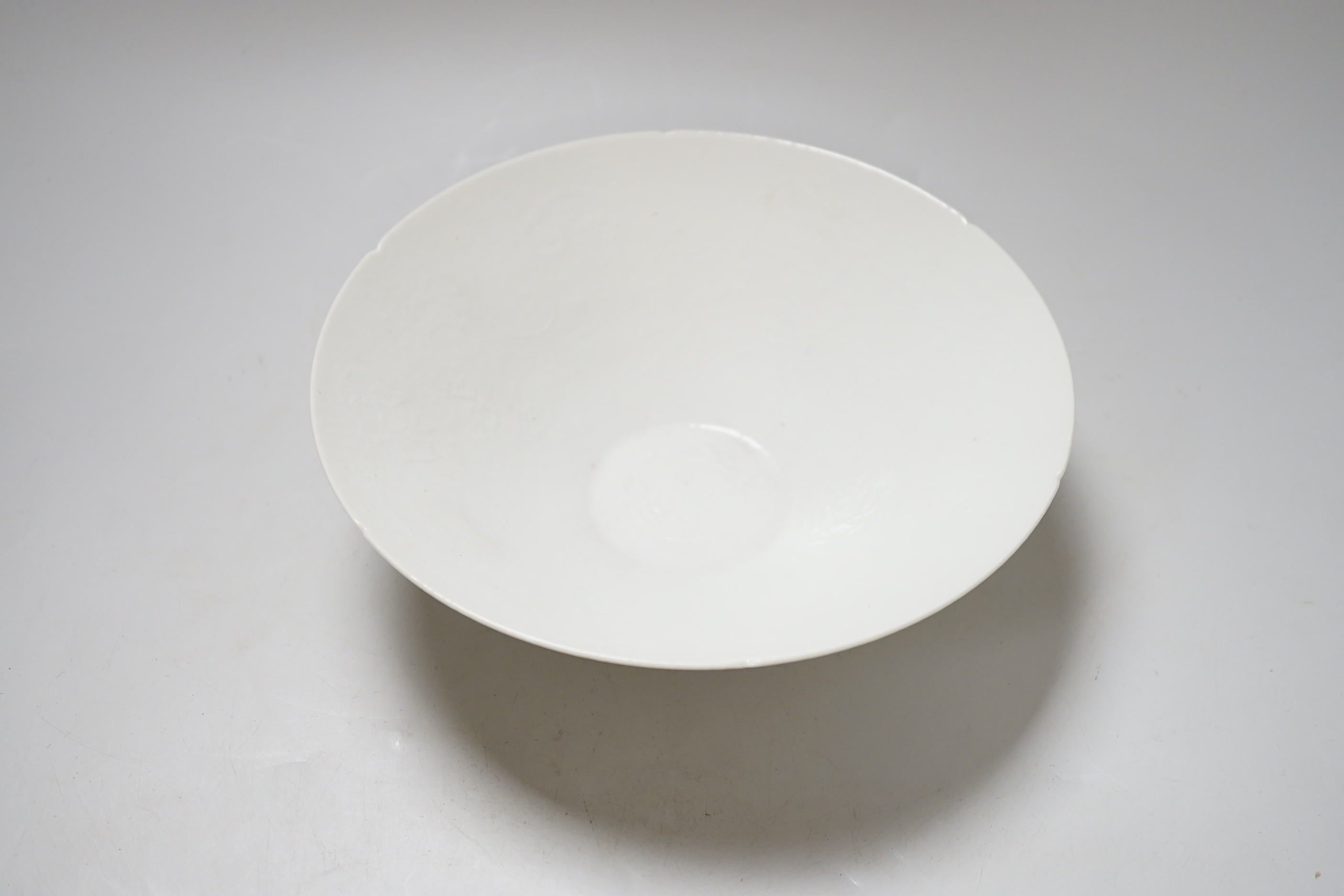 A Chinese white Anhua decorated conical dish, 20cm